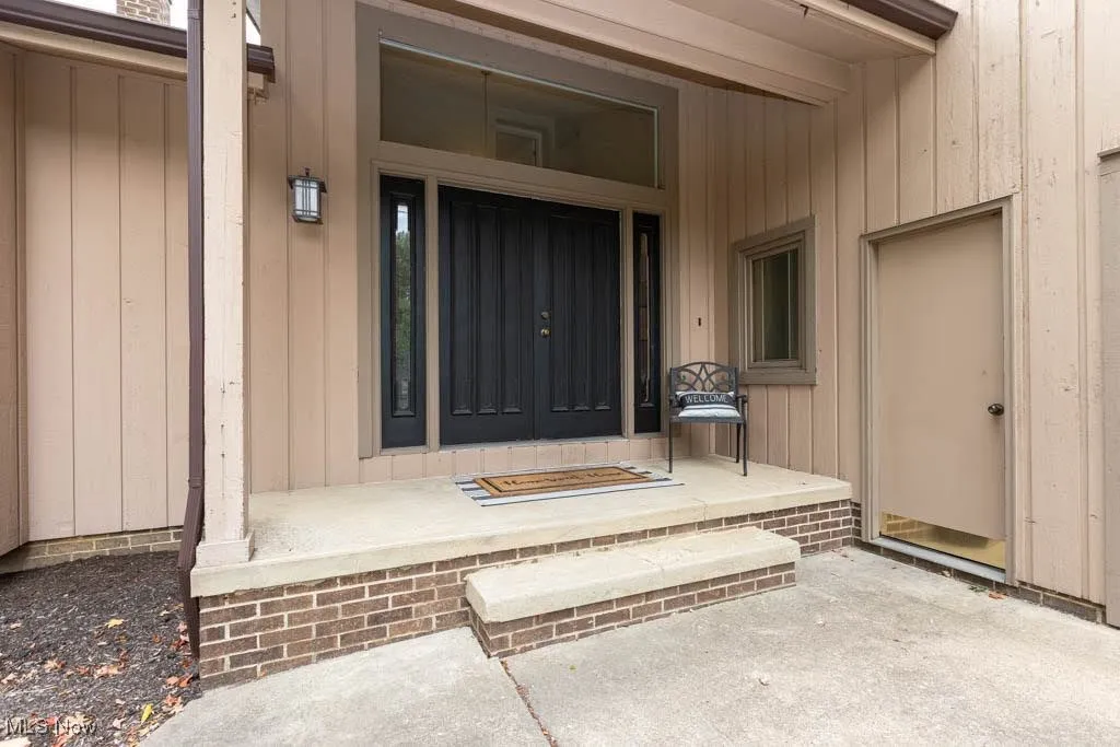 Entrance to property featuring a porch