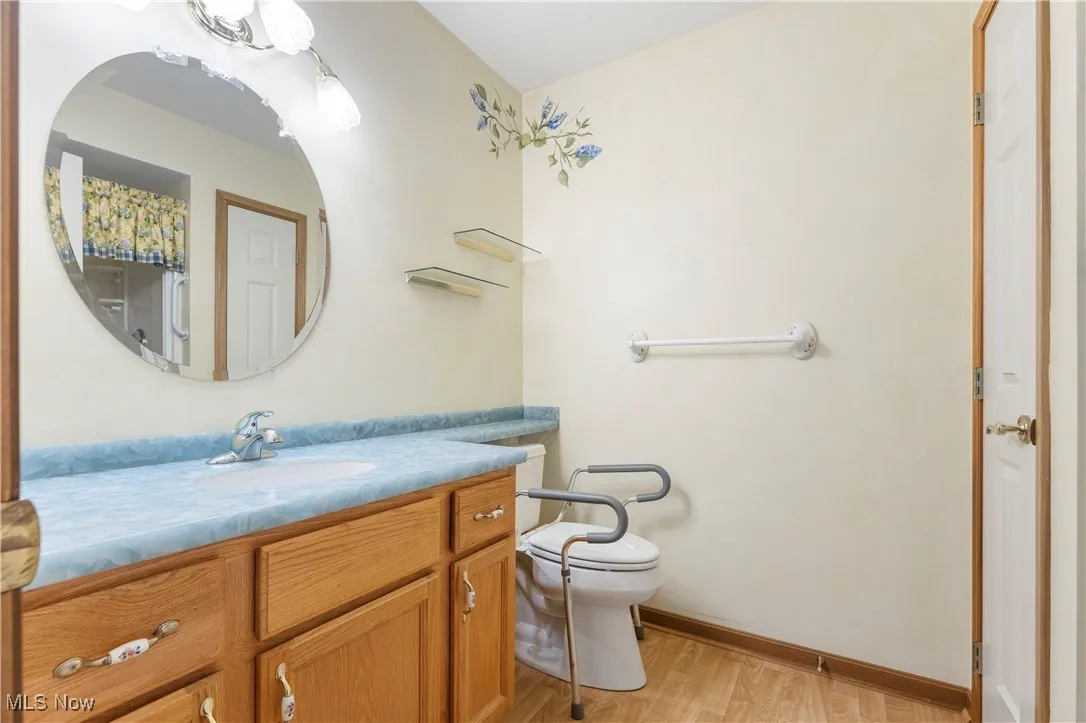 Full bathroom featuring vanity and light wood finished floors