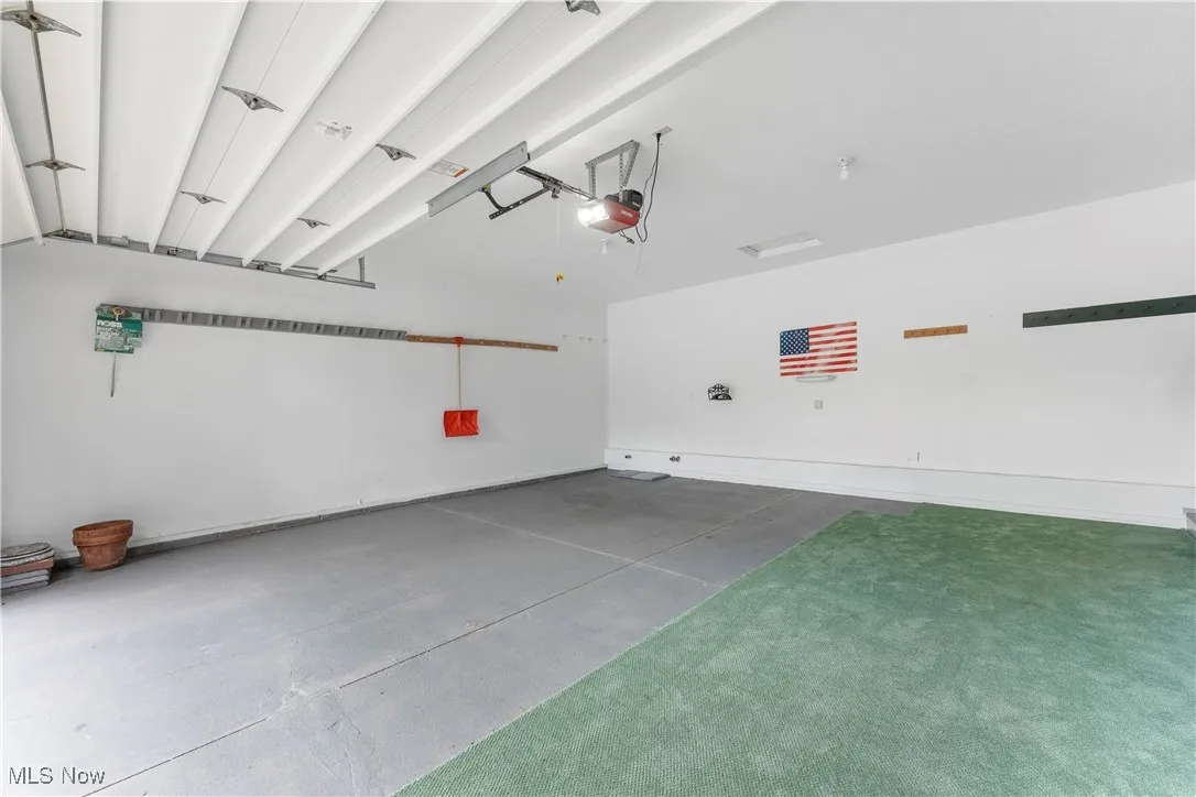 Garage featuring a garage door opener