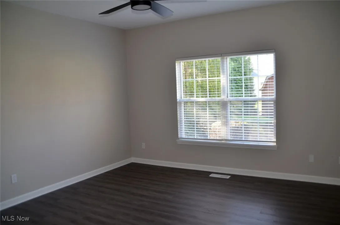 Nice sized bedroom with natural light from large window, ceiling fan too!