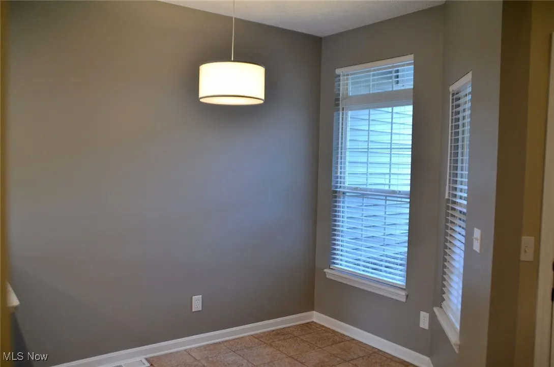 Nice eating area in the kitchen with natural lighting from two windows