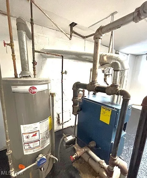 Utilities featuring gas water heater and a heating unit