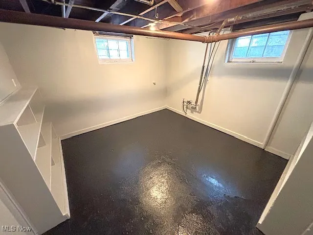 Basement featuring baseboards