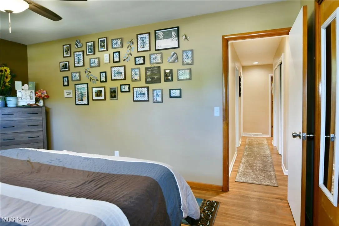 Bedroom featuring light wood-style floors and ceiling fan