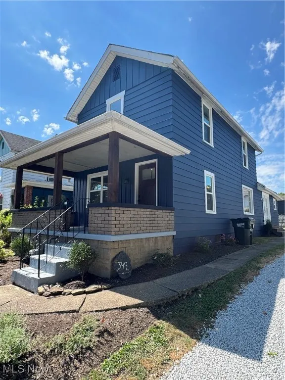 View of property exterior featuring board and batten siding and a porch