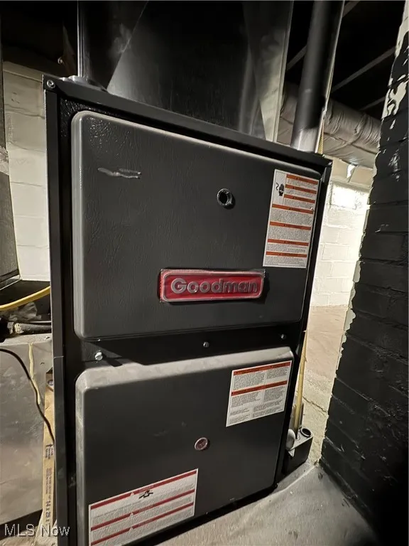 Utility room featuring heating unit