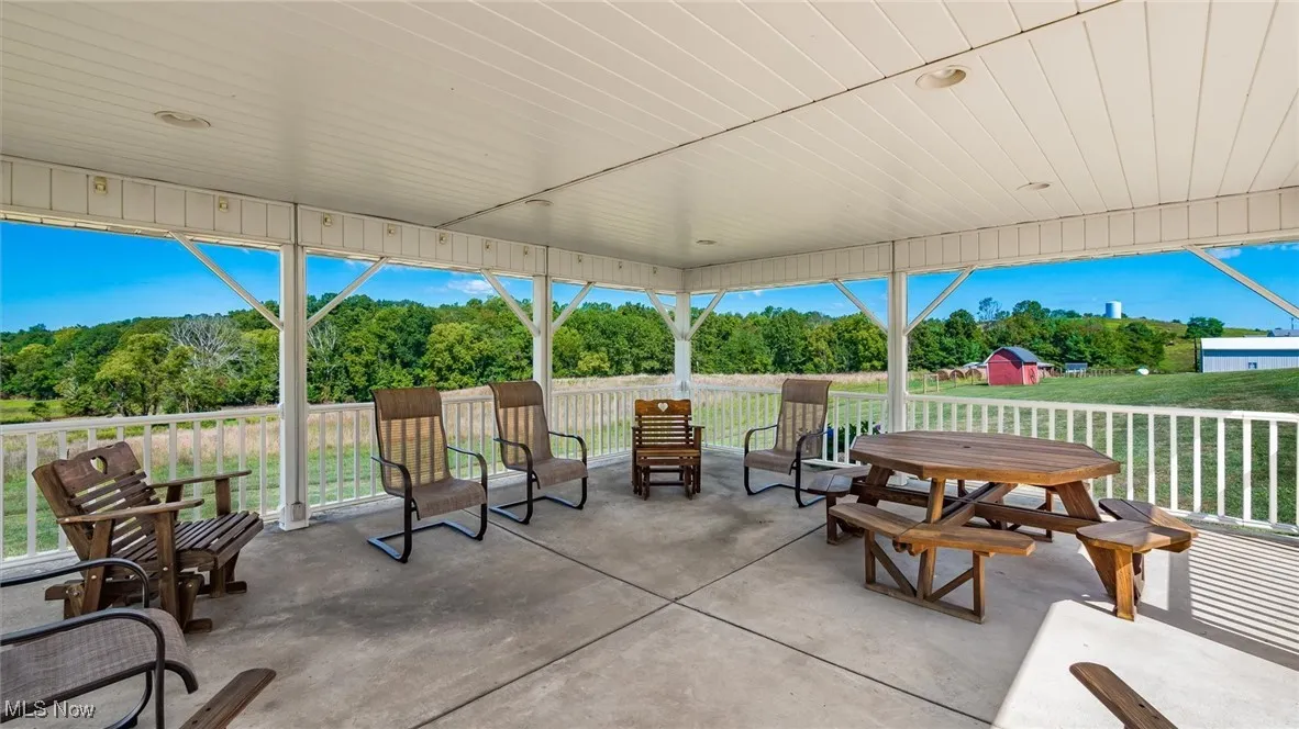 View of patio featuring view of scattered trees