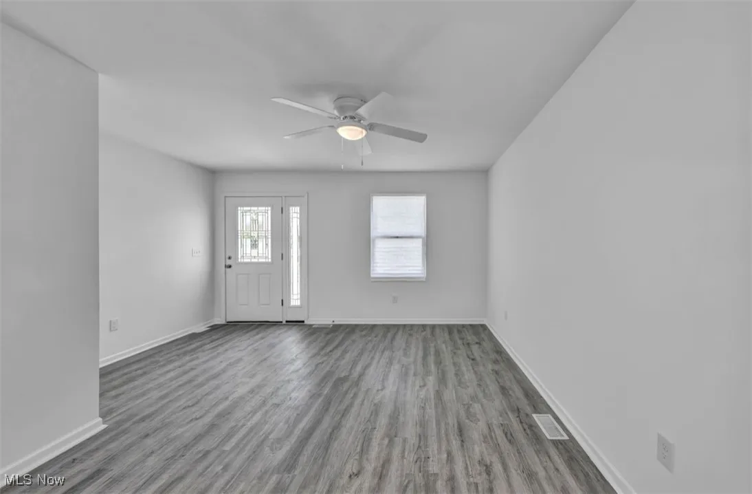 Foyer entrance featuring wood finished floors and ceiling fan