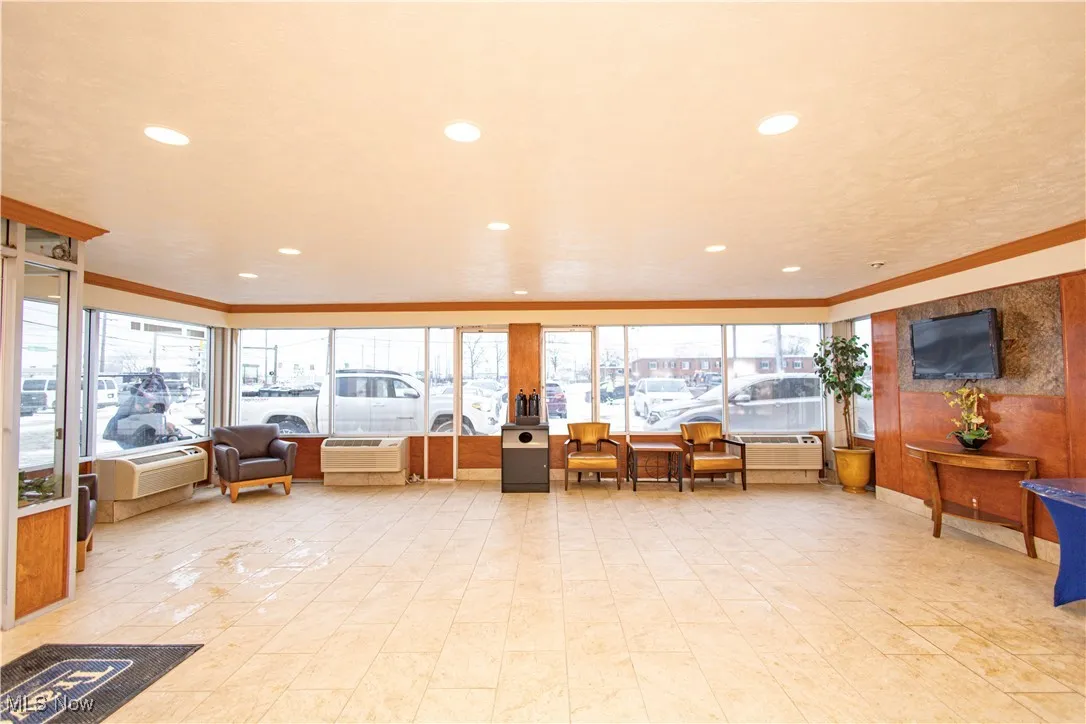 Building lobby featuring crown molding and recessed lighting