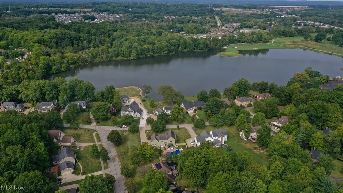 View of property location with nearby suburban area and a large body of water