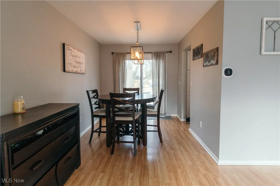 Dining space featuring baseboards and light wood-type flooring