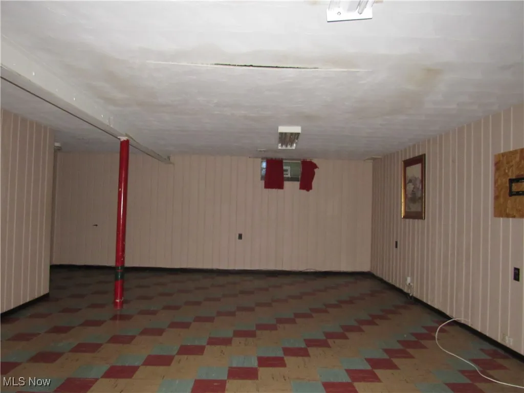 Finished basement with tile patterned floors