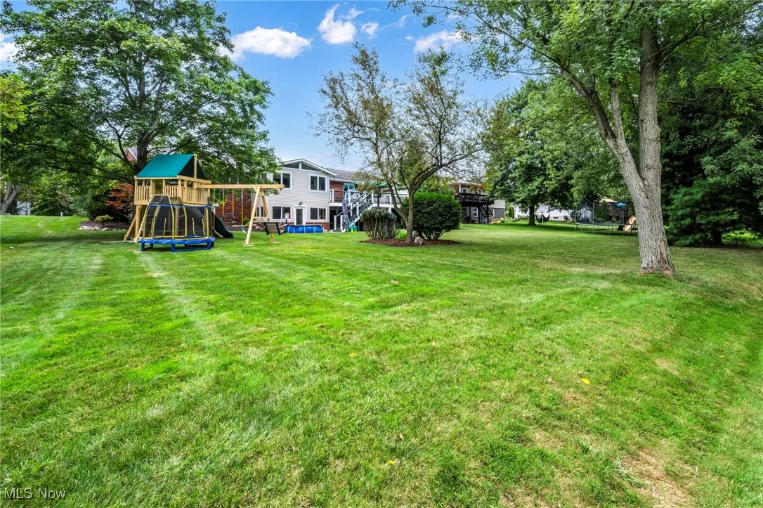 View of green lawn with a playground