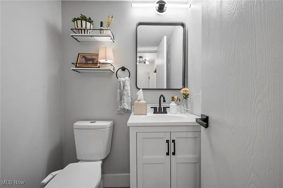 Bathroom with vanity and toilet