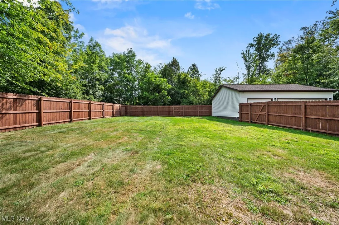 View of fenced backyard