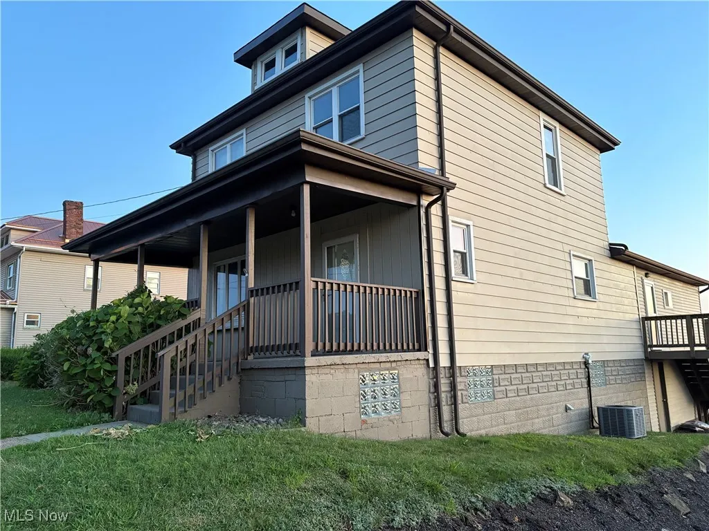 View of front porch and side deck