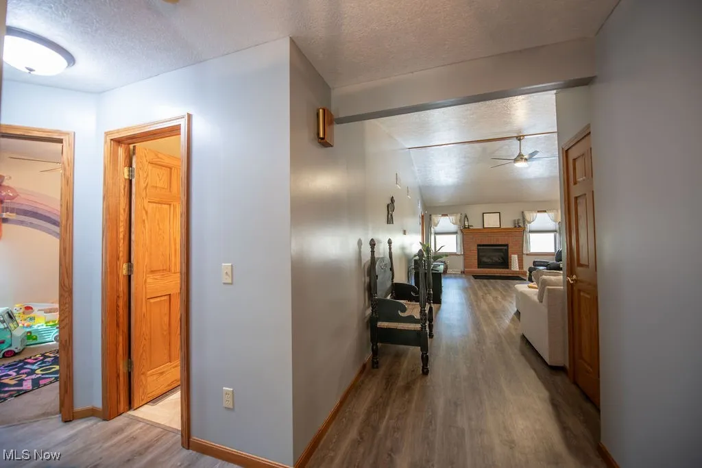View of hallway area into bath and additional bedrooms