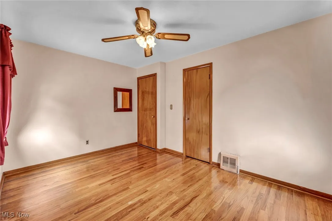 Unfurnished bedroom with light wood-style flooring and ceiling fan