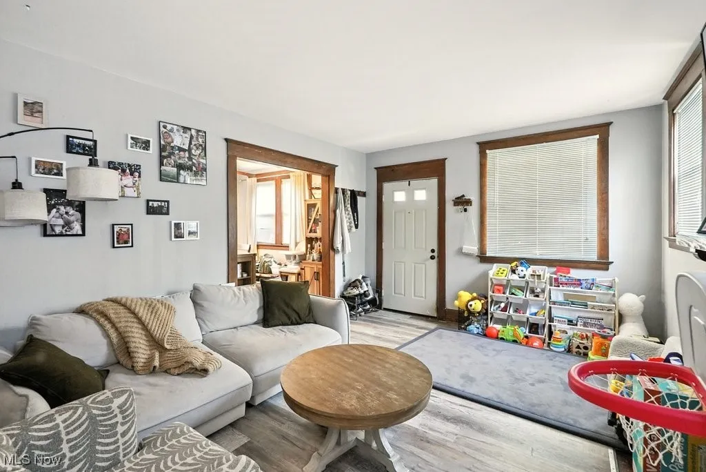 Living room featuring wood finished floors and healthy amount of natural light