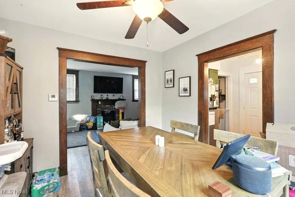 Dining room with wood finished floors and ceiling fan