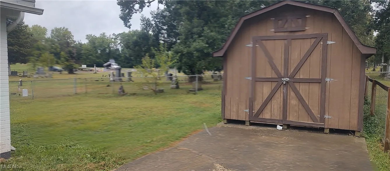 View of shed with view of wooded area