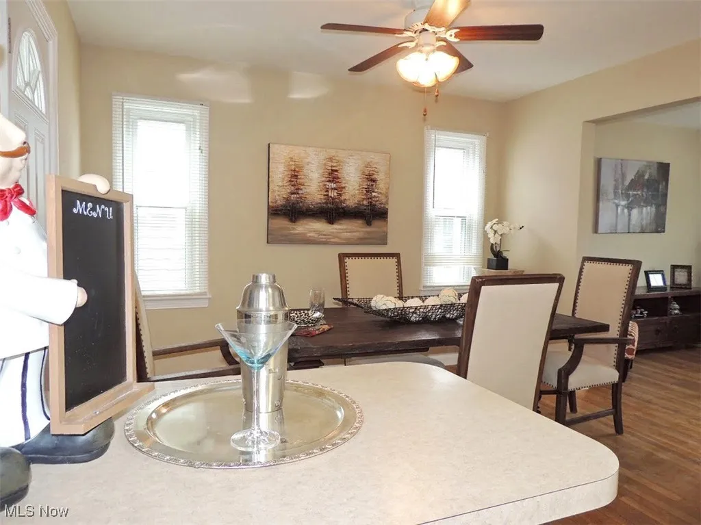 Dining space featuring wood finished floors and a ceiling fan