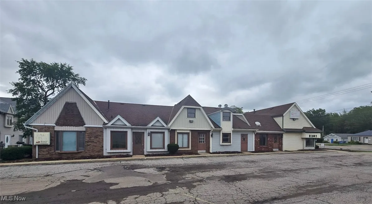 View of front of house featuring brick siding
