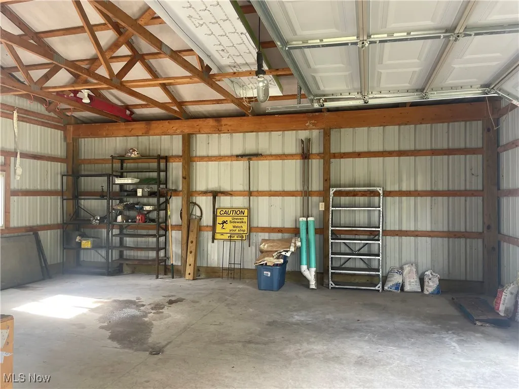 Garage featuring metal walls and metal roof