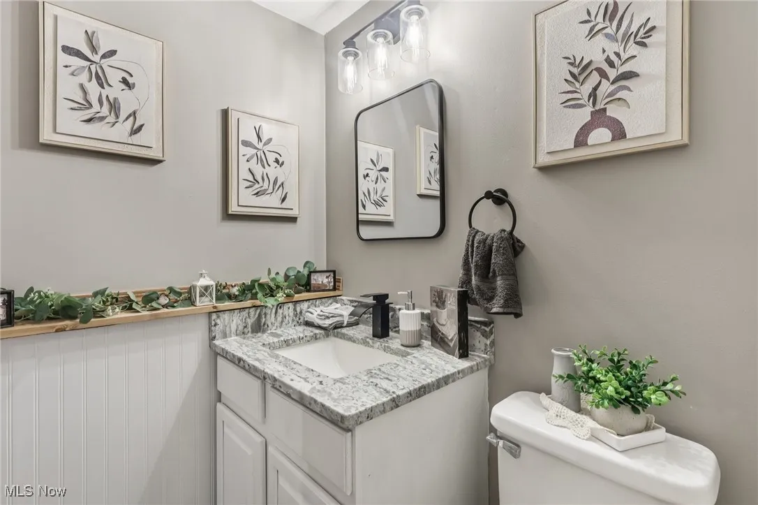 Bathroom featuring vanity and toilet