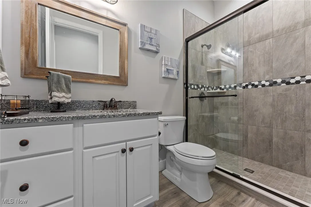 Bathroom two with tiled shower.