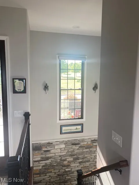 Staircase with feature wall to lower level.
