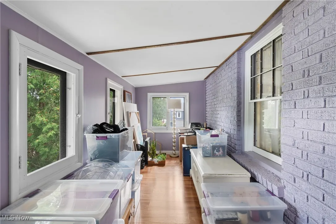 Sunroom / solarium with lofted ceiling