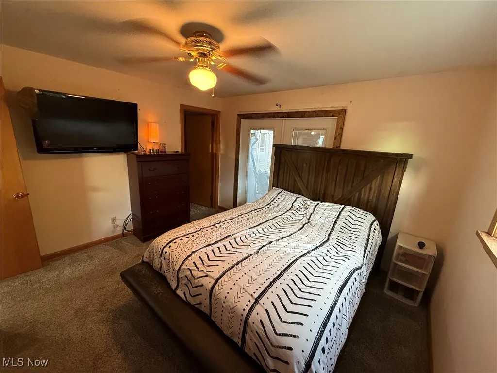Bedroom featuring carpet and a ceiling fan
