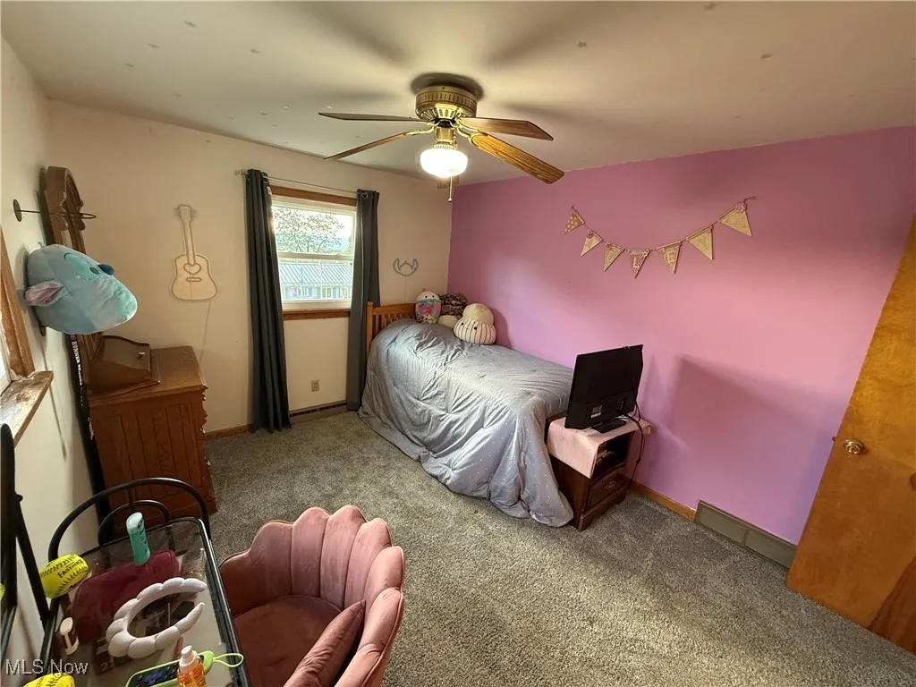 Bedroom with carpet floors and ceiling fan