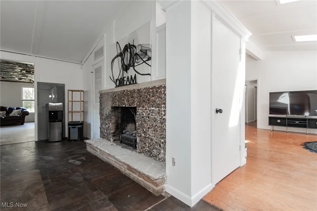 Unfurnished living room featuring a premium fireplace