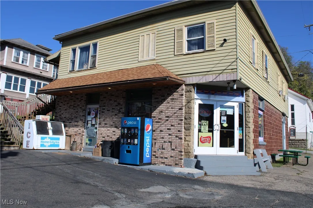 Traditional home featuring brick siding