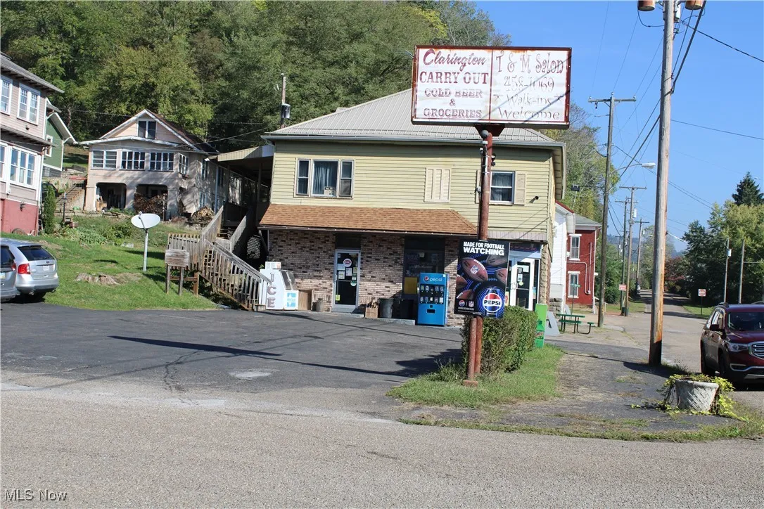 View of front of home featuring brick siding and driveway