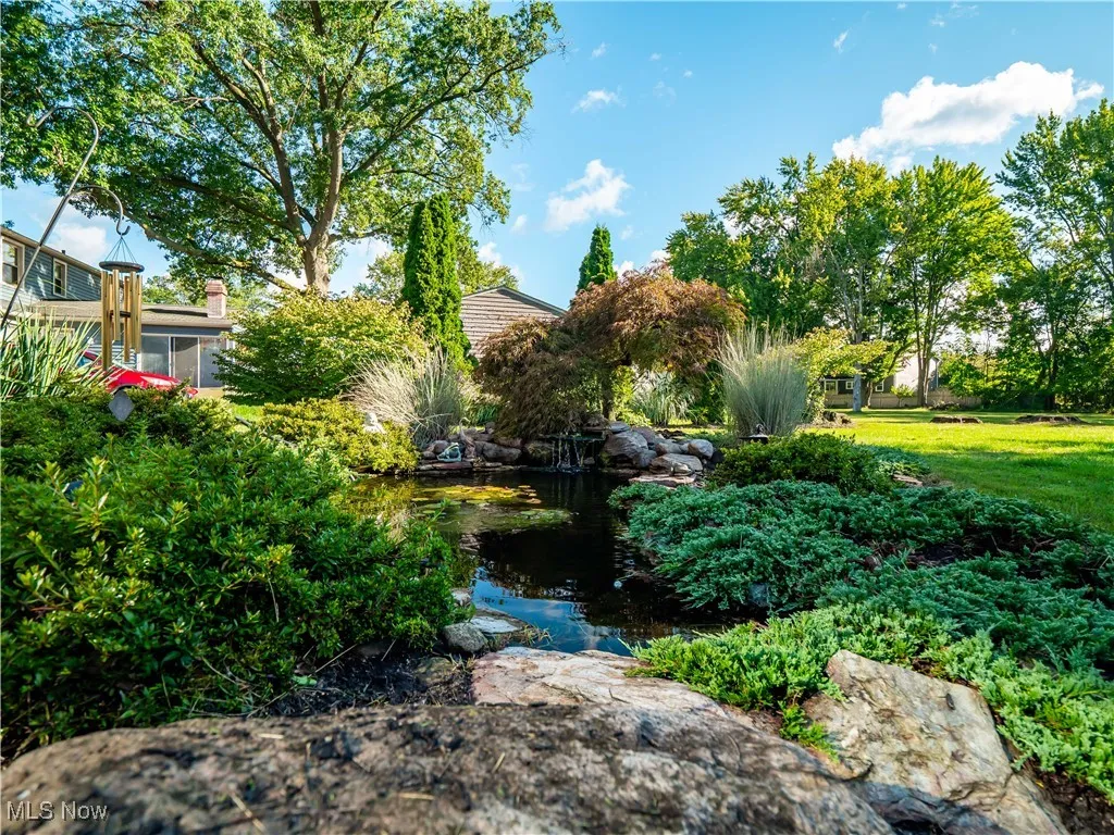 View of yard featuring a garden pond