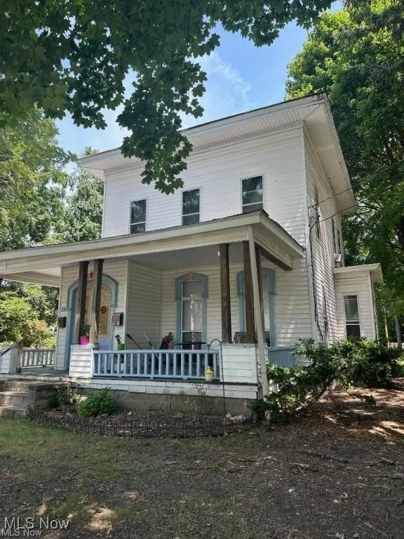 View of front facade featuring a porch