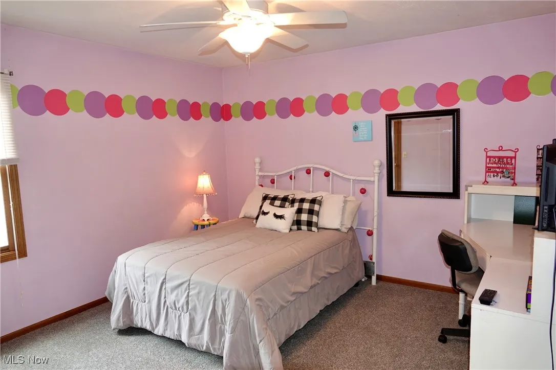 Bedroom with carpet and ceiling fan