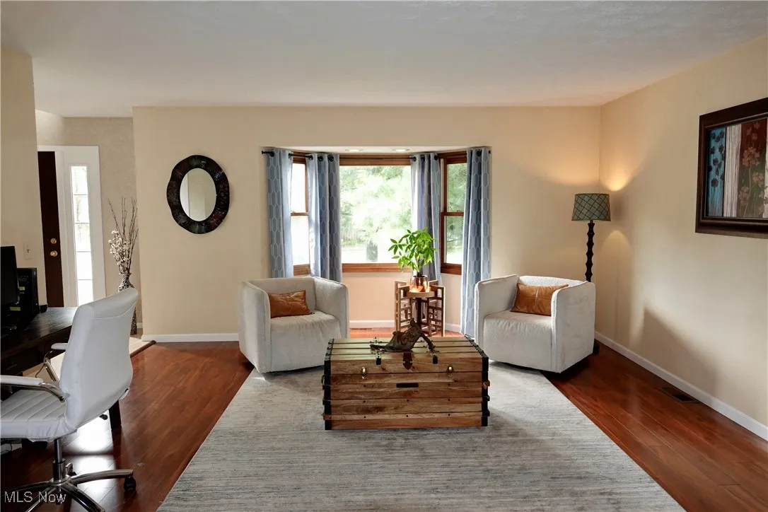 Living area featuring an office area and wood finished floors