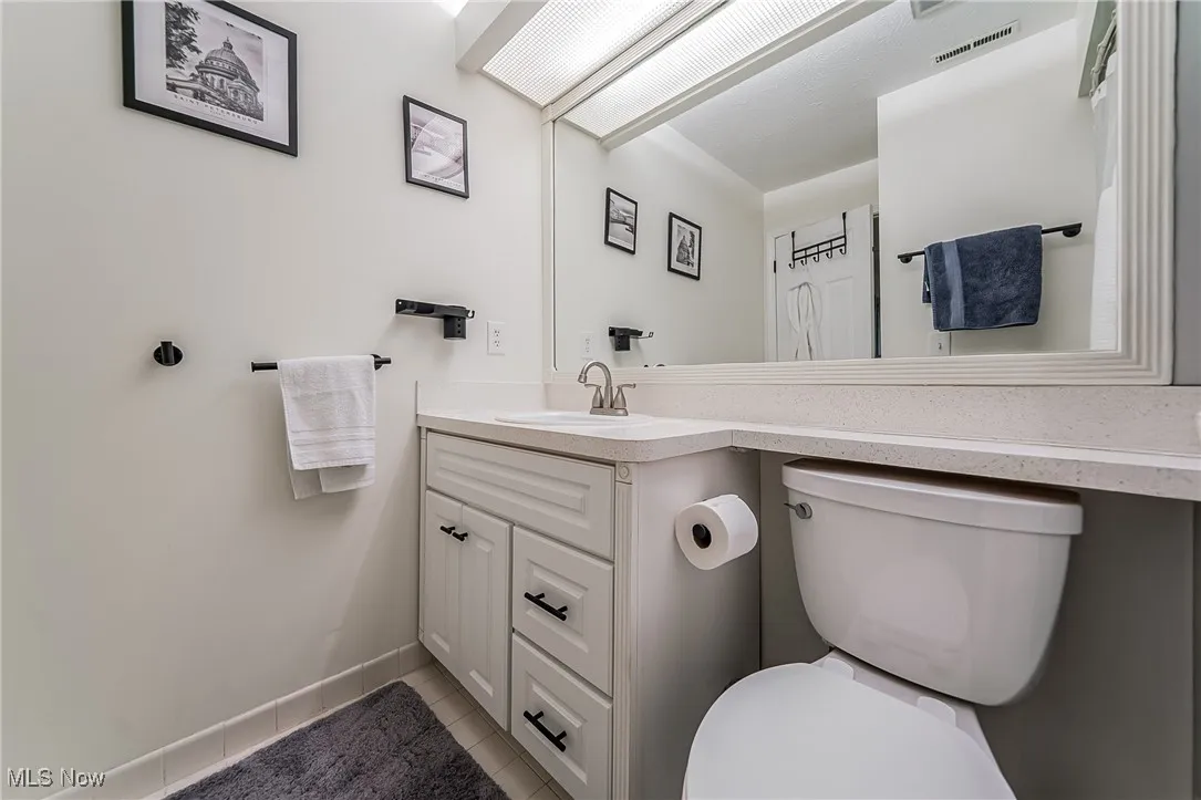 Bathroom featuring vanity and light tile patterned floors