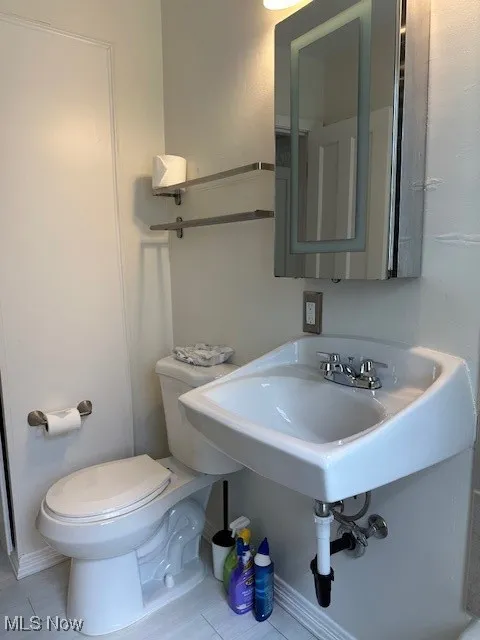 Bathroom with toilet and a sink