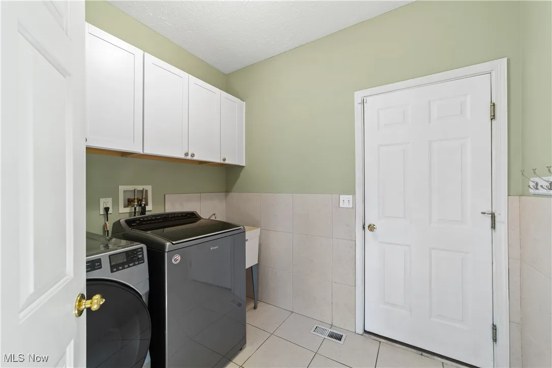 First floor laundry and mud room with access to garage