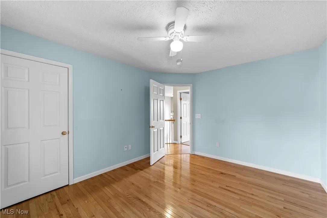 Second floor bedroom with ceiling fan