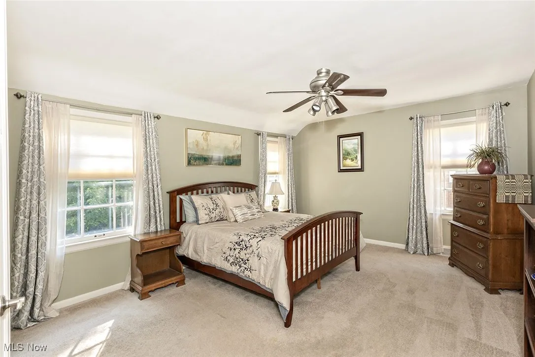 Primary bedroom with custom walk-in closet providing direct access to a fabulous fully renovated full bathroom