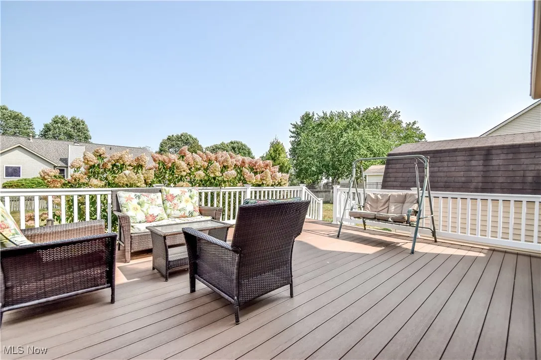 Wooden deck featuring outdoor lounge area