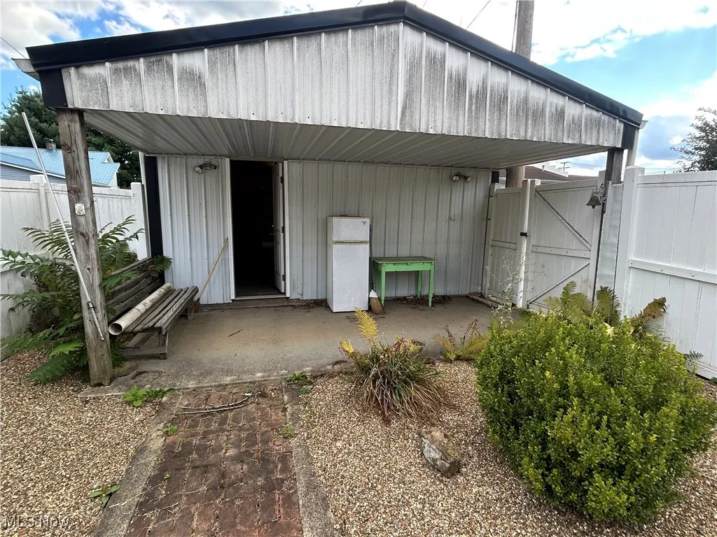 Entrance to property featuring a gate