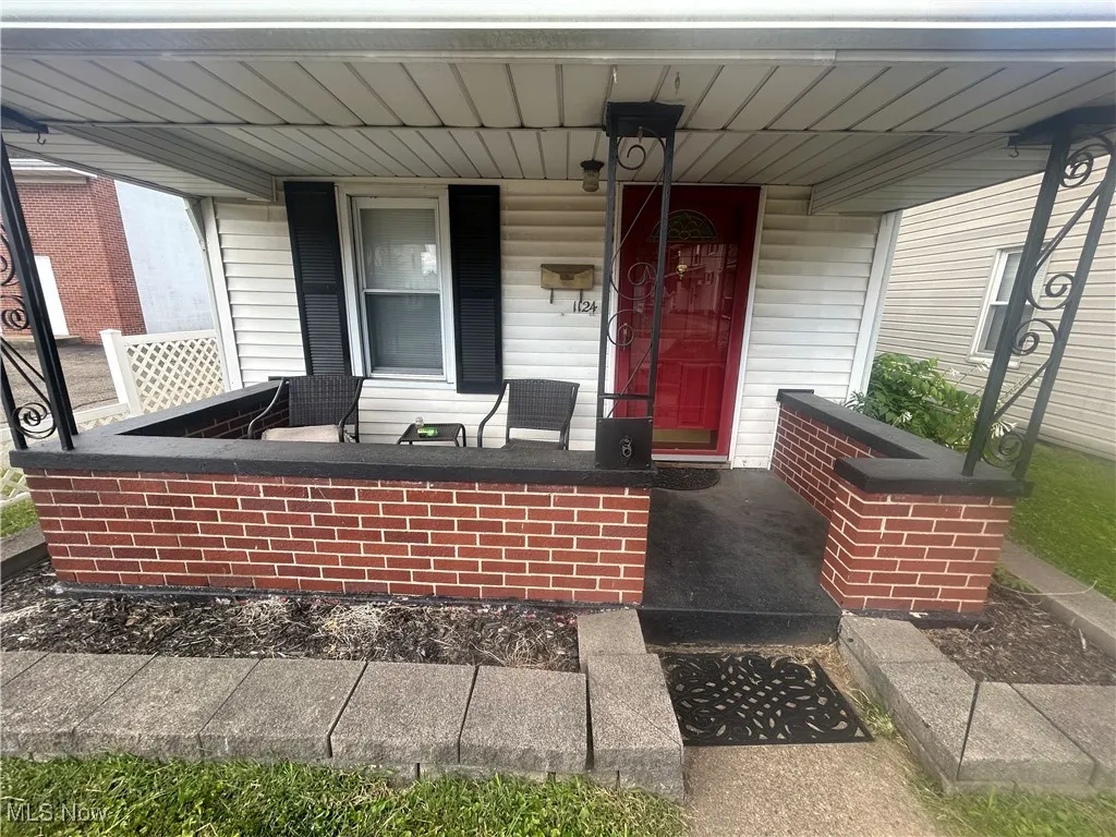Property entrance with covered porch