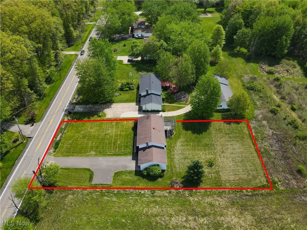 3740 Wilson Sharpsville Rd, Cortland, Ohio 44410 – Your dream home awaits! This stunning 5-bed, 3-bath single-family residence, completely renovated top-to-bottom, sits on a spacious 0.58-acre lot, blending luxury, functionality, and room to grow. Step into a bright, airy open-concept living space, perfect for modern living and effortless entertaining. The heart of the home is a gourmet kitchen featuring sleek Black Stainless Steel Samsung appliances, gorgeous Quartz Countertops, and an oversized island—ideal for meal prep, casual dining, or hosting. Enjoy abundant natural light through new windows and great installed lighting. Luxury LVT Shaw flooring flows seamlessly throughout, adding warmth and durability. Each of the three full bathrooms is beautifully updated with stylish finishes, offering a spa-like retreat.